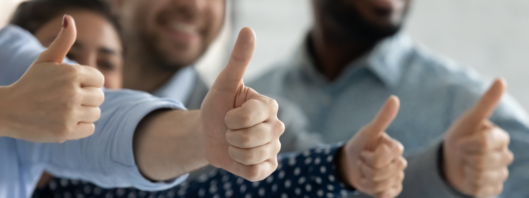 Close up diverse employees showing thumbs up together, team building, happy overjoyed colleagues recommending best corporate service, good career opportunities, human resources and employment concept