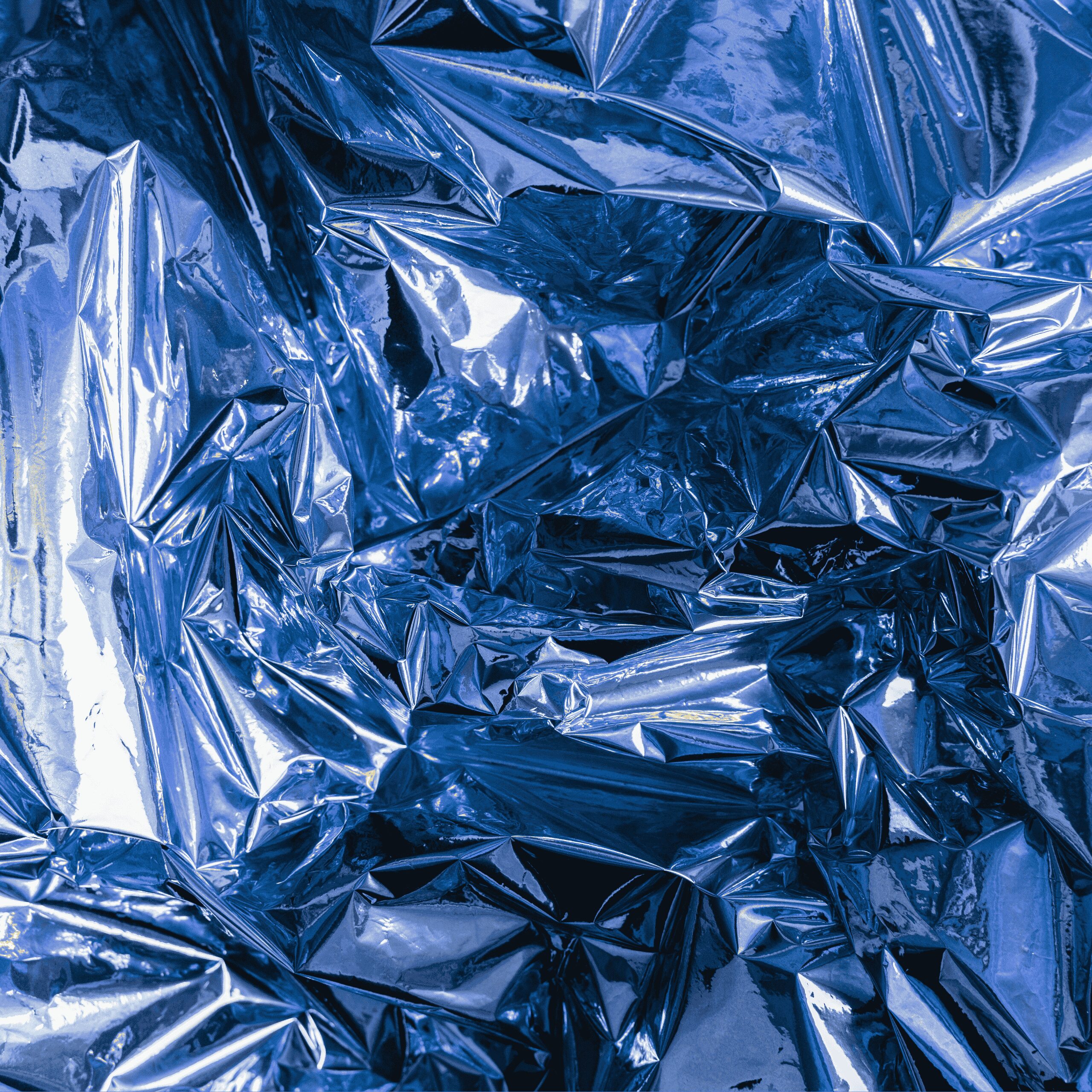 crinkeled up blue aluminium foil